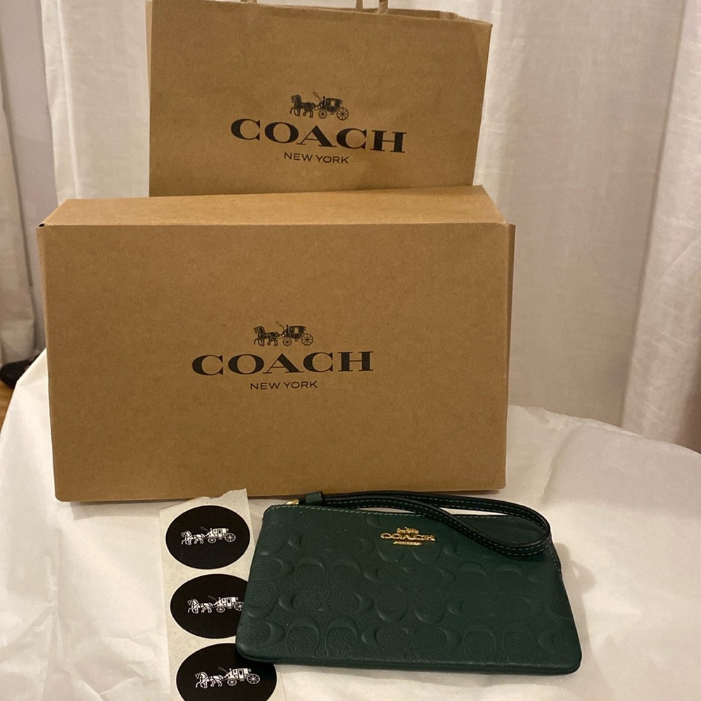 Coach wallet. New with gift box, bag and authenticity card. Perfect for gift!